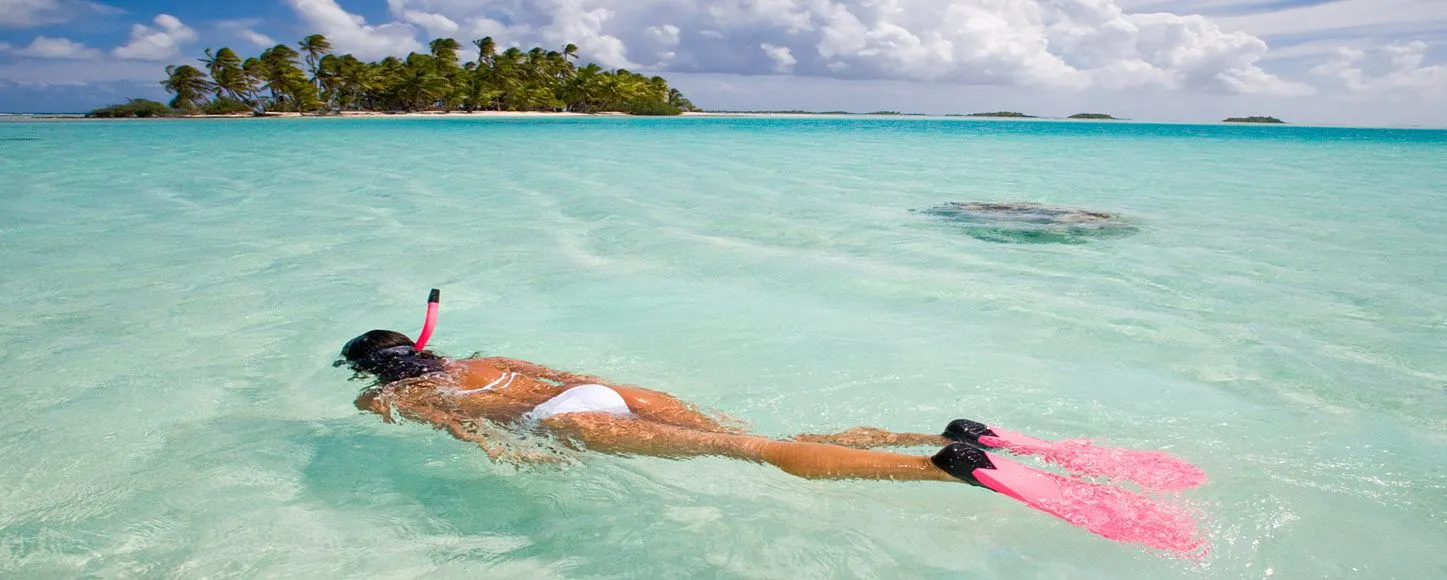 snorkeling next to an island in Tahiti