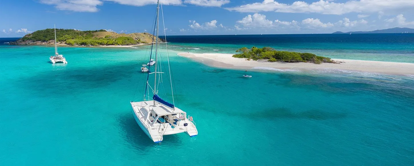 charter yachts anchored near islands in the Caribbean